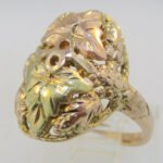10k Black Hills Ring with 2 Leafs and Berry Designs. Size 4